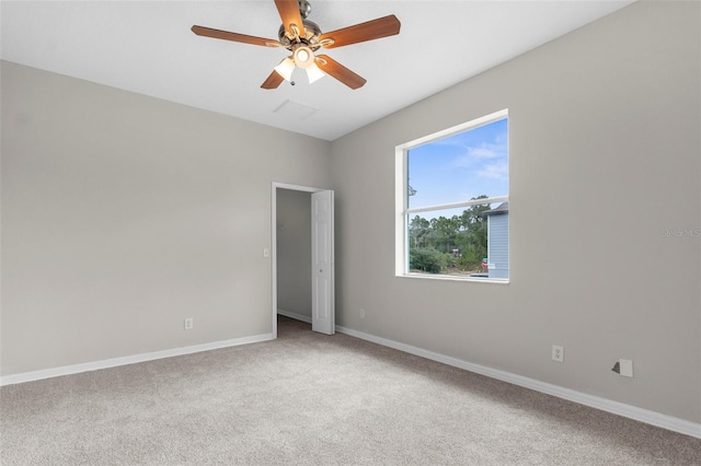 11344 Gallinule Ave, Weeki Wachee, FL 34613 - unfurnished room with a ceiling fan, baseboards, and carpet