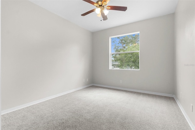 11344 Gallinule Ave, Weeki Wachee, FL 34613 - empty room with carpet floors, baseboards, and a ceiling fan