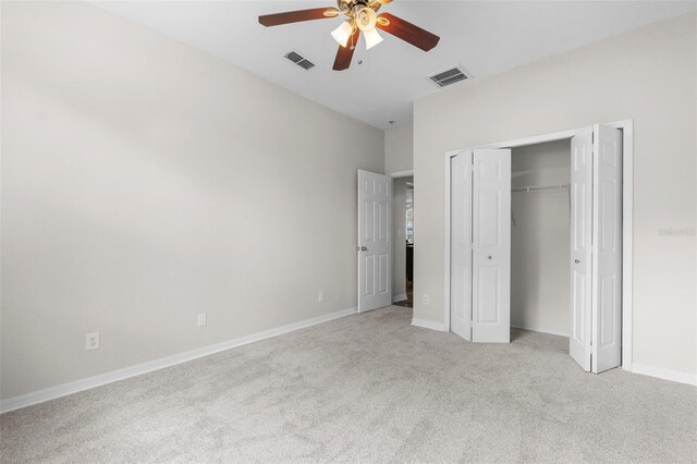 11344 Gallinule Ave, Weeki Wachee, FL 34613 - unfurnished bedroom featuring a closet, baseboards, carpet flooring, and visible vents