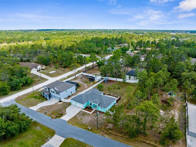 11344 Gallinule Ave, Weeki Wachee, FL 34613 - drone / aerial view featuring a wooded view