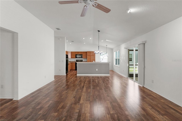 unfurnished living room featuring dark wood-style flooring, visible vents, ceiling fan with notable chandelier, baseboards, and vaulted ceiling