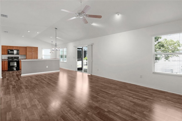 unfurnished living room featuring dark wood-style flooring, baseboards, lofted ceiling, and ceiling fan with notable chandelier