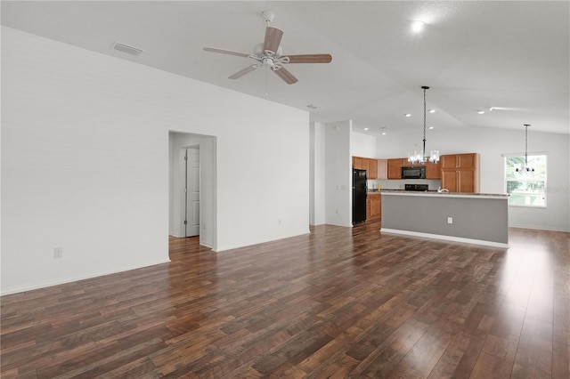 unfurnished living room featuring visible vents, dark wood-style flooring, ceiling fan with notable chandelier, and lofted ceiling