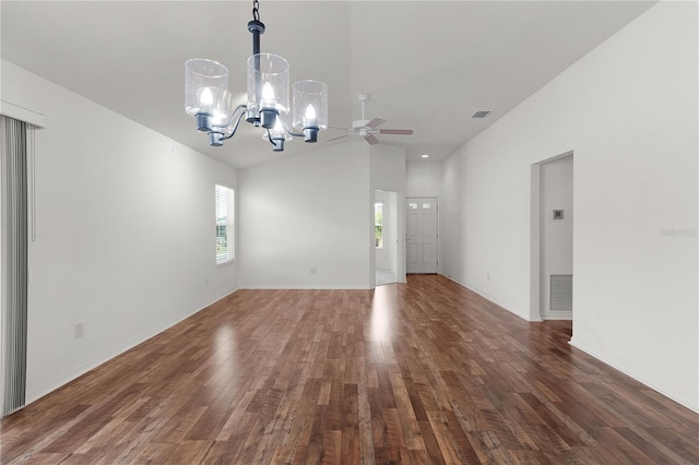 interior space with visible vents, ceiling fan with notable chandelier, wood finished floors, and high vaulted ceiling