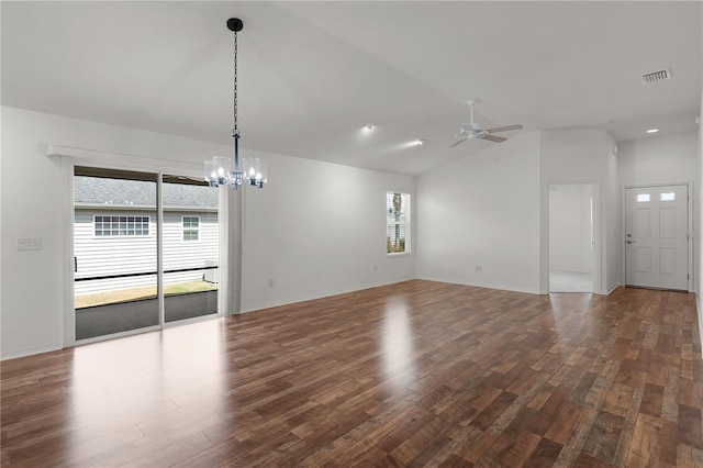 interior space with visible vents, ceiling fan with notable chandelier, recessed lighting, wood finished floors, and vaulted ceiling