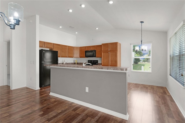 kitchen featuring brown cabinets, hanging light fixtures, lofted ceiling, dark wood-style floors, and black appliances