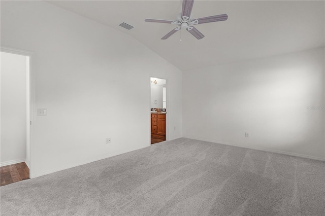 unfurnished room with high vaulted ceiling, ceiling fan, carpet flooring, and visible vents