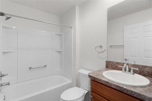 bathroom featuring toilet, tub / shower combination, and vanity