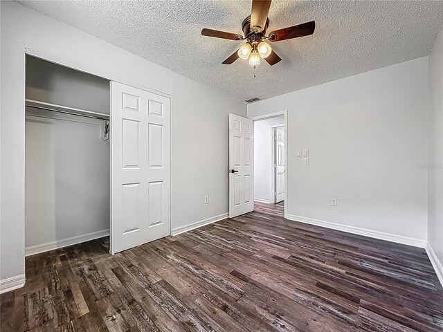 unfurnished bedroom featuring a textured ceiling, wood finished floors, and visible vents