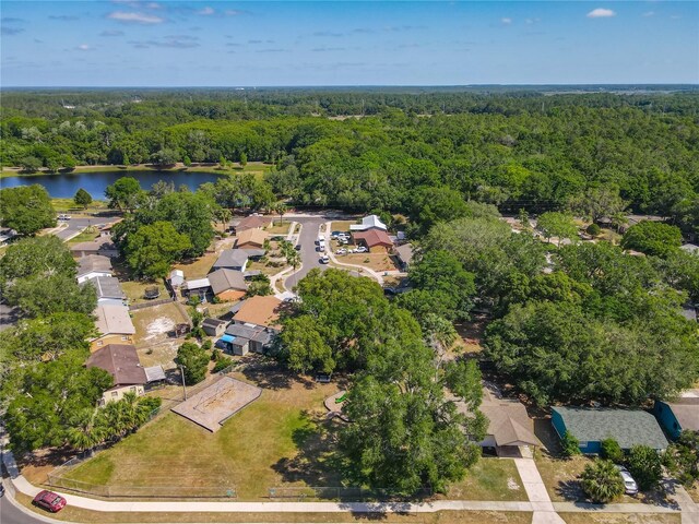 bird's eye view featuring a water view and a view of trees
