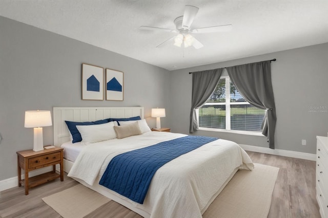 36700 Oconee Ave, Eustis, FL 32736 - bedroom featuring a ceiling fan, baseboards, and light wood-style floors