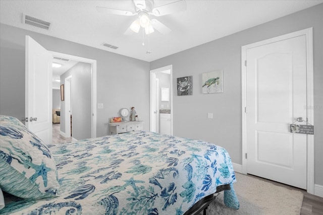 36700 Oconee Ave, Eustis, FL 32736 - bedroom featuring visible vents, a ceiling fan, baseboards, and wood finished floors