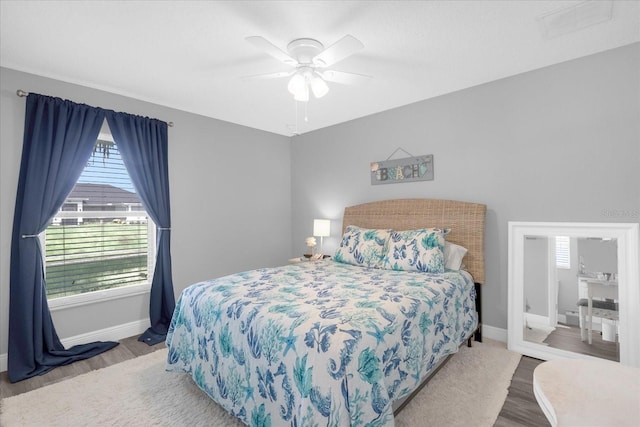 36700 Oconee Ave, Eustis, FL 32736 - bedroom featuring baseboards, a ceiling fan, and wood finished floors