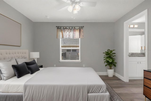 36700 Oconee Ave, Eustis, FL 32736 - bedroom featuring a ceiling fan, baseboards, wood finished floors, and ensuite bathroom