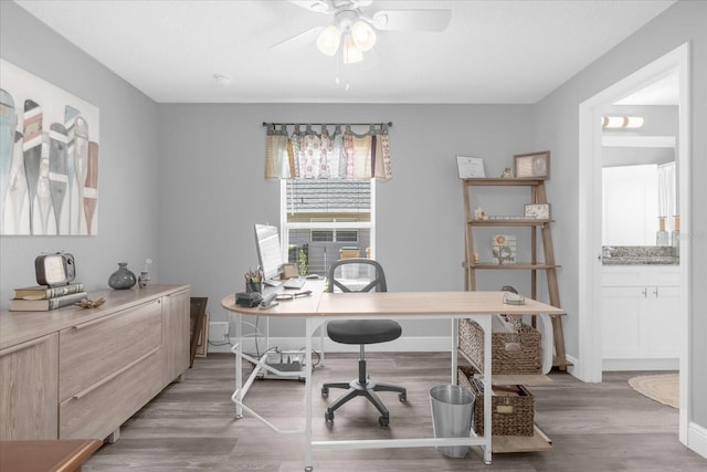 36700 Oconee Ave, Eustis, FL 32736 - office featuring light wood-style floors, a ceiling fan, and baseboards