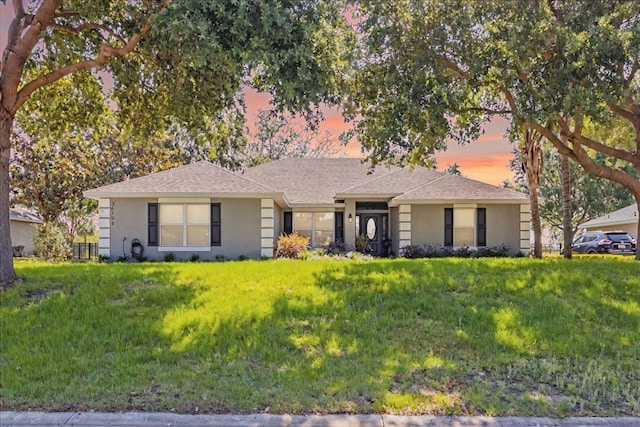 36700 Oconee Ave, Eustis, FL 32736 - ranch-style house with roof with shingles and stucco siding