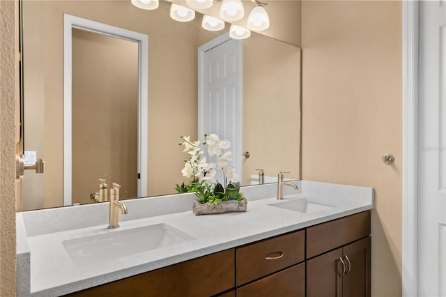 full bath with a sink and double vanity