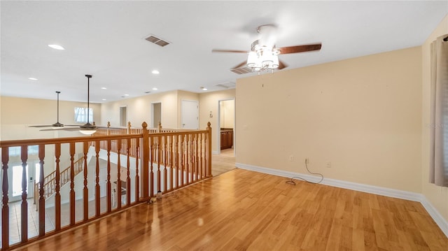 spare room with visible vents, baseboards, ceiling fan, light wood-style floors, and recessed lighting