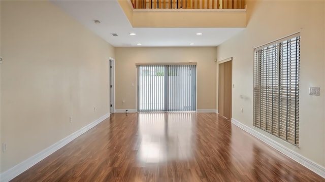 interior space with wood finished floors, visible vents, baseboards, and recessed lighting