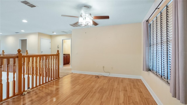 unfurnished room featuring recessed lighting, baseboards, ceiling fan, visible vents, and light wood-style floors