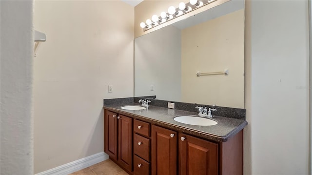 full bathroom with a sink, tile patterned flooring, and double vanity