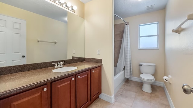 bathroom with toilet, baseboards, visible vents, tile patterned floors, and vanity