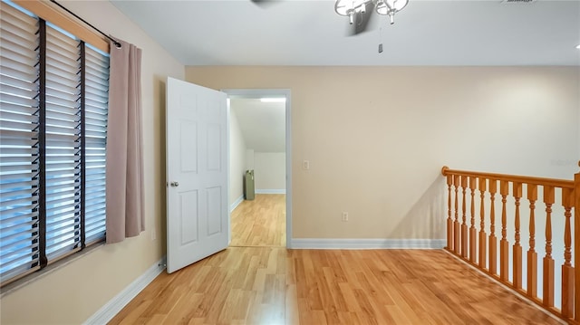 interior space with baseboards and light wood-style floors