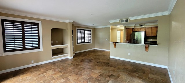 14049 Fairway Island Dr Unit 118, Orlando, FL 32837 - unfurnished living room with crown molding, stone finish flooring, baseboards, and visible vents