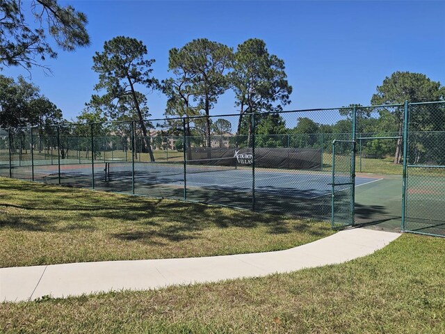 14049 Fairway Island Dr Unit 118, Orlando, FL 32837 - view of sport court with a yard and fence