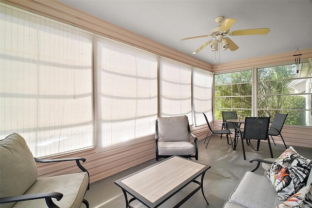 1318 Guerra Ave, The Villages, FL 32159 - sunroom with ceiling fan, concrete floors, a healthy amount of sunlight, and outdoor dining space