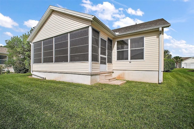 1318 Guerra Ave, The Villages, FL 32159 - back of house featuring a sunroom, a yard, and entry steps