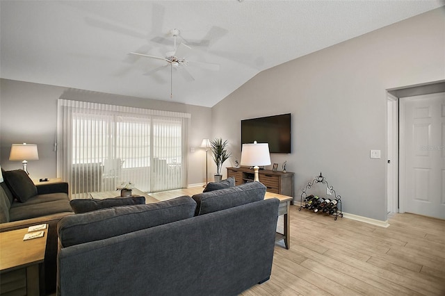 1318 Guerra Ave, The Villages, FL 32159 - living room featuring baseboards, ceiling fan, light wood-type flooring, and lofted ceiling