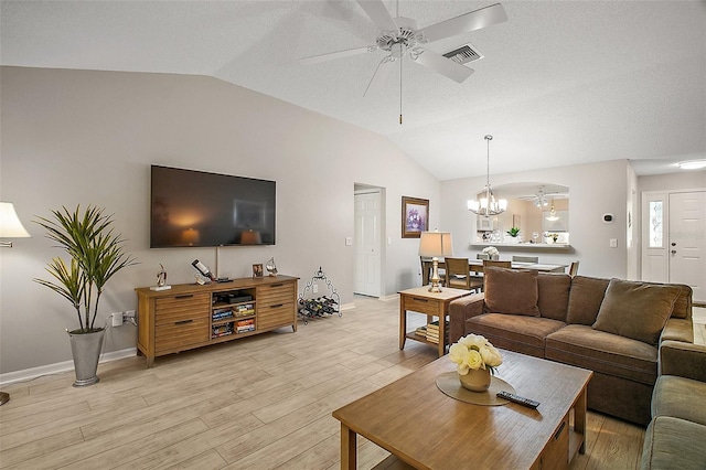 1318 Guerra Ave, The Villages, FL 32159 - living room with visible vents, light wood-style flooring, ceiling fan with notable chandelier, baseboards, and vaulted ceiling