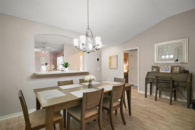 1318 Guerra Ave, The Villages, FL 32159 - dining room with baseboards, lofted ceiling, ceiling fan with notable chandelier, and light wood-type flooring