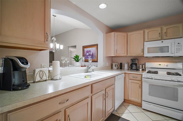1318 Guerra Ave, The Villages, FL 32159 - kitchen featuring a sink, light brown cabinets, white appliances, and light countertops