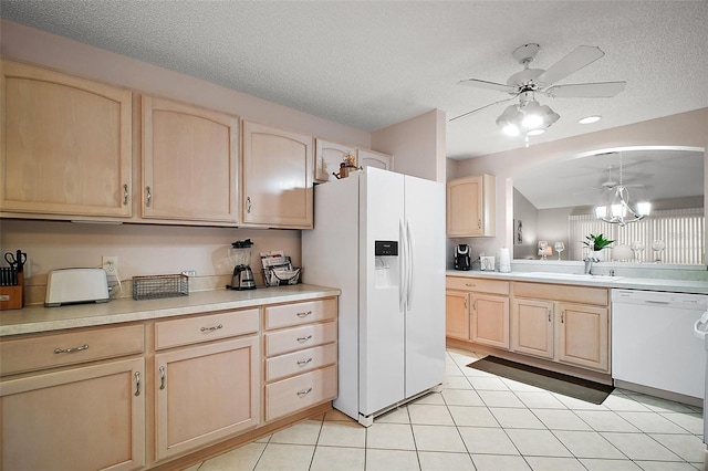 1318 Guerra Ave, The Villages, FL 32159 - kitchen with a sink, ceiling fan, light brown cabinetry, and white appliances