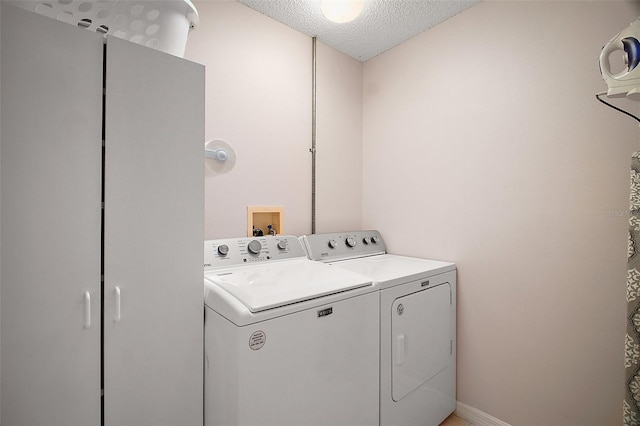 1318 Guerra Ave, The Villages, FL 32159 - laundry room with laundry area, a textured ceiling, and washer and dryer