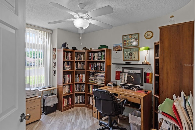 5500 Laver St, Leesburg, FL 34748 - office area with a textured ceiling, ceiling fan, and light wood-style floors