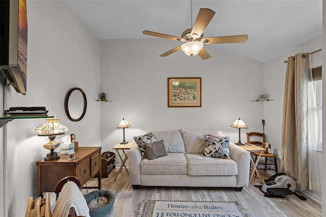 5500 Laver St, Leesburg, FL 34748 - living area with vaulted ceiling, a ceiling fan, and wood finished floors