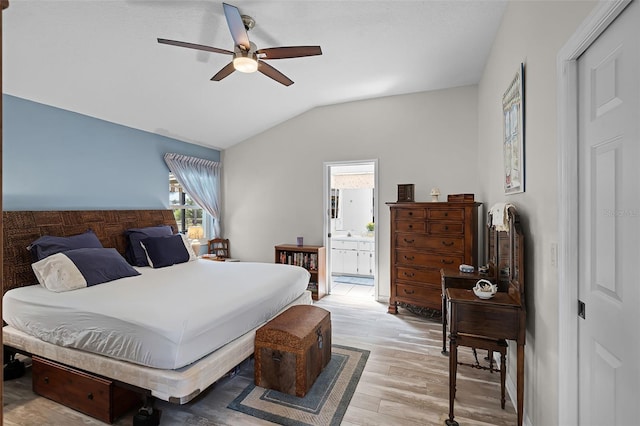 5500 Laver St, Leesburg, FL 34748 - bedroom with ensuite bathroom, a ceiling fan, light wood finished floors, and vaulted ceiling