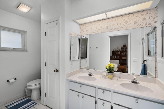 5500 Laver St, Leesburg, FL 34748 - bathroom with double vanity, a sink, tile patterned floors, and toilet