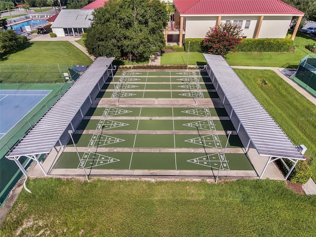 5500 Laver St, Leesburg, FL 34748 - surrounding community with a lawn and shuffleboard