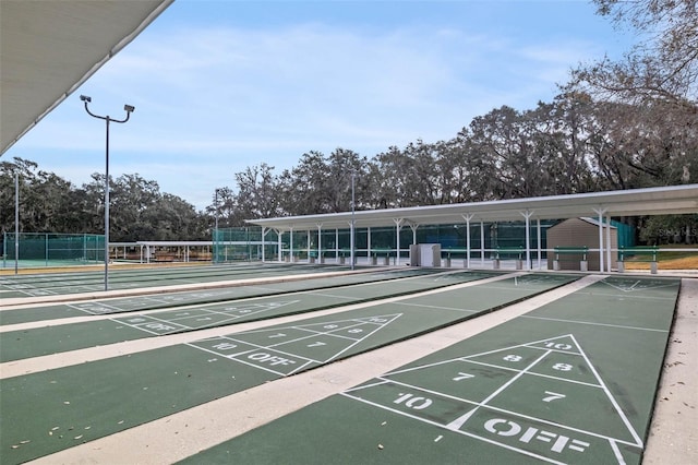 5500 Laver St, Leesburg, FL 34748 - surrounding community featuring shuffleboard, fence, and uncovered parking