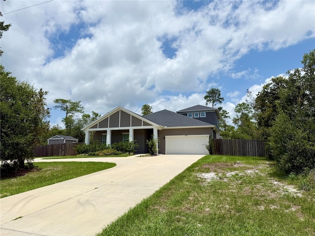 31857 Dahlia Ct, Eustis, FL 32736 - view of front facade with driveway, an attached garage, and stucco siding