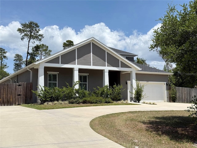 31857 Dahlia Ct, Eustis, FL 32736 - view of front of property featuring driveway, stucco siding, and an attached garage