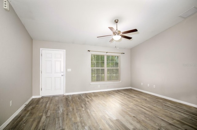 unfurnished room featuring baseboards, ceiling fan, and wood finished floors