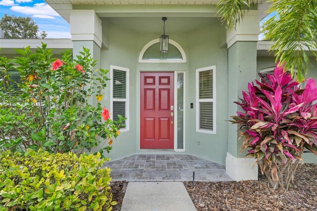 8709 Augusta Ct, Clermont, FL 34711 - view of exterior entry with stucco siding