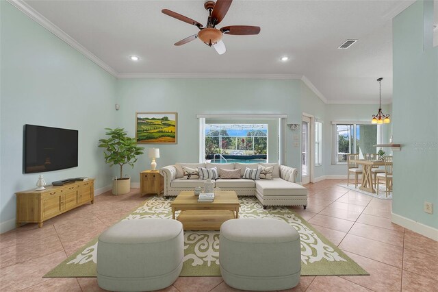 8709 Augusta Ct, Clermont, FL 34711 - living room with visible vents, ornamental molding, baseboards, and light tile patterned flooring