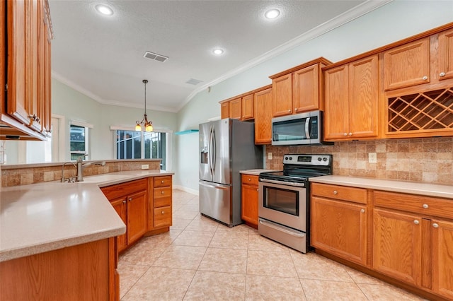 8709 Augusta Ct, Clermont, FL 34711 - kitchen with crown molding, tasteful backsplash, a sink, light countertops, and stainless steel appliances