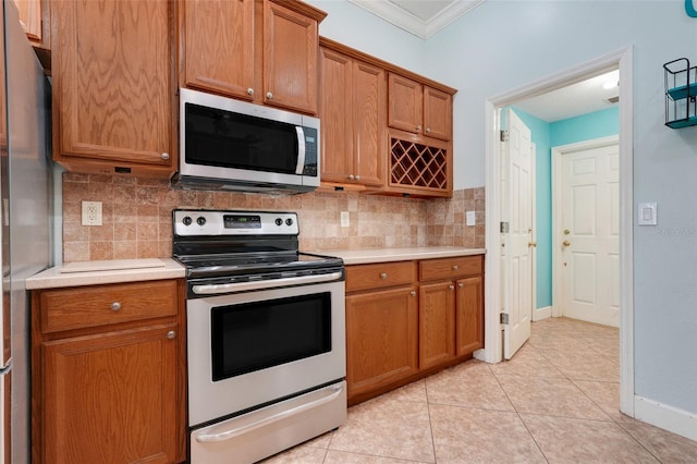 8709 Augusta Ct, Clermont, FL 34711 - kitchen featuring light countertops, stainless steel appliances, ornamental molding, and backsplash